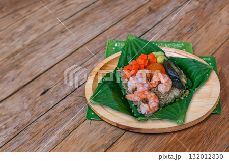 Steamed sticky rice wrapped in lotus leaf 132012830