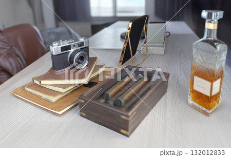 A classic vintage camera, leather journals, premium cigars in a wooden box, and a bottle of amber liquor on a modern table, suggesting luxury, travel, and refined leisure. A classic vintage camera, leather journals, premium cigars in a wooden box, and a bottle of amber liquor on a modern table, suggesting luxury, travel, and refined leisure. 132012833