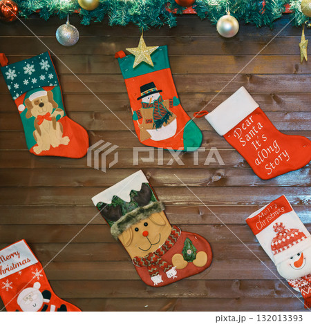 Christmas background with Christmas santa claus socks with decoration and lights. Merry Christmas, holiday and happy New Year concept Christmas background with Christmas santa claus socks with decoration and lights. Merry Christmas, holiday and happy New Year concept 132013393