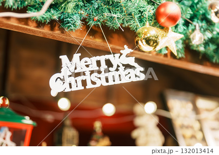 Christmas market background with Christmas tree with decoration and lights. Merry Christmas, holiday and happy New Year concept 132013414