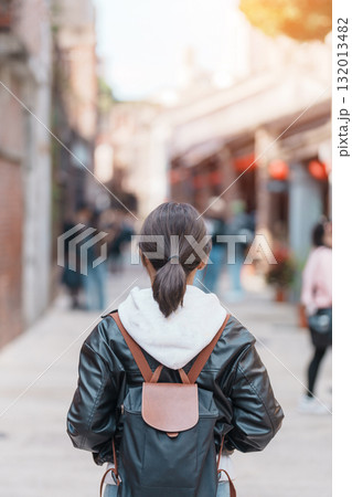 woman traveler visiting in Taiwan, Tourist with backpack sightseeing at Bopiliao Historic Block, landmark and popular attractions in Taipei city. Asia Travel and vacation concept woman traveler visiting in Taiwan, Tourist with backpack sightseeing at Bopiliao Historic Block, landmark and popular attractions in Taipei city. Asia Travel and vacation concept 132013482