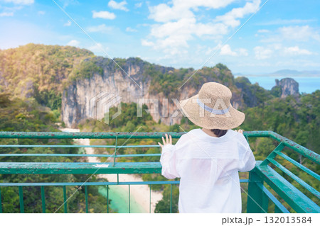 Woman tourist traveling in Krabi, Thailand. happy traveller enjoy and sightseeing view at koh Hong island viewpoint. summer trip, destination, Southeast Asia Travel, vacation and holiday concept 132013584