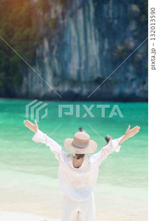 Woman tourist traveling and sightseeing in Krabi, Thailand. happy traveller enjoy on beach at koh Hong island. summer trip, destination, Southeast Asia Travel, vacation and holiday concept 132013590
