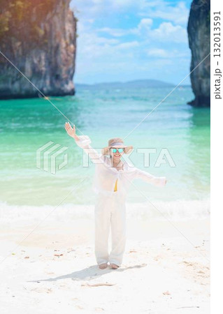 Woman tourist traveling and sightseeing in Krabi, Thailand. happy traveller enjoy on beach at koh Hong island. summer trip, destination, Southeast Asia Travel, vacation and holiday concept 132013591