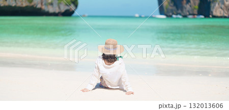 Woman tourist traveling and sightseeing in Krabi, Thailand, happy traveller enjoy at Maya Bay beach on Phi Phi island, Popular paradise island, destination, Southeast Asia Travel, vacation and holiday 132013606