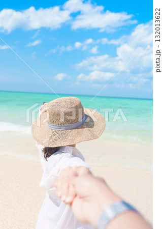 couple tourist relaxing and enjoying on beach, happy traveller looking beautiful sea view on tropical island. Honeymoon, tropical destination, southeast Asia Travel, summer vacation and wanderlust 132013622