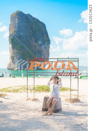Woman tourist traveling and sightseeing in Krabi, Thailand. happy traveller enjoy on beach at Koh Poda island. summer trip, destination, Southeast Asia Travel, vacation and holiday concept 132013625