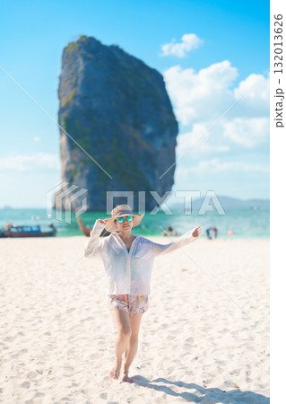 Woman tourist traveling and sightseeing in Krabi, Thailand. happy traveller enjoy on beach at Koh Poda island. summer trip, destination, Southeast Asia Travel, vacation and holiday concept Woman tourist traveling and sightseeing in Krabi, Thailand. happy traveller enjoy on beach at Koh Poda island. summer trip, destination, Southeast Asia Travel, vacation and holiday concept 132013626
