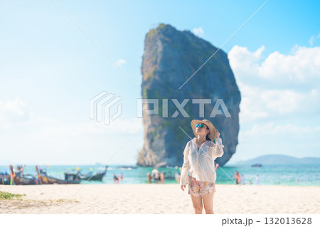 Woman tourist traveling and sightseeing in Krabi, Thailand. happy traveller enjoy on beach at Koh Poda island. summer trip, destination, Southeast Asia Travel, vacation and holiday concept Woman tourist traveling and sightseeing in Krabi, Thailand. happy traveller enjoy on beach at Koh Poda island. summer trip, destination, Southeast Asia Travel, vacation and holiday concept 132013628