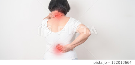 Elderly woman having back body ache for concepts of Back Muscle Strain, Piriformis Syndrome, Low Back Pain, Lumbar Disc Degeneration, Herniated, Osteoporosis, Spinal Compression and Health care Elderly woman having back body ache for concepts of Back Muscle Strain, Piriformis Syndrome, Low Back Pain, Lumbar Disc Degeneration, Herniated, Osteoporosis, Spinal Compression and Health care 132013664