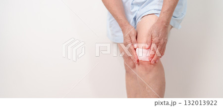 Elderly woman having knee ache with Medicated pain relief patch plaster to Runners Knee or Patellofemoral Pain Syndrome, osteoarthritis, arthritis, rheumatism and Patellar Tendinitis. Senior health Elderly woman having knee ache with Medicated pain relief patch plaster to Runners Knee or Patellofemoral Pain Syndrome, osteoarthritis, arthritis, rheumatism and Patellar Tendinitis. Senior health 132013922