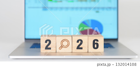 2026 Year block with magnifying glass icon against laptop computer. SEO, Search Engine Optimization, hiring , Advertising, Idea, Strategy, marketing, Keyword, Content and New Year start concepts 132014108