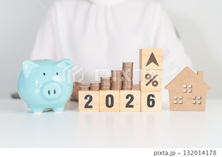 2026 New Year with percentage change to UP and Down arrow, Home model and coin stack. Real estate Mortgage, Refinance, House loan and debt, Interest rate, Insurance, Financial and Property Tax 132014178