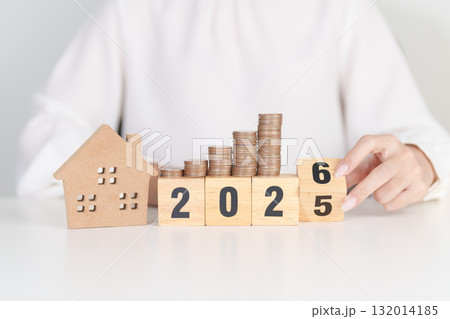 2025 end year to Happy New Year 2026 with house model and Coins stack. real estate, Home loan, tax, investment, mortgage, financial, savings and New Year Resolution concepts 2025 end year to Happy New Year 2026 with house model and Coins stack. real estate, Home loan, tax, investment, mortgage, financial, savings and New Year Resolution concepts 132014185