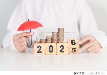 2025 end year to Happy New Year 2026 with hand holding red umbrella and money stack growing. Insurance, protection, safety and New year holiday Concepts 2025 end year to Happy New Year 2026 with hand holding red umbrella and money stack growing. Insurance, protection, safety and New year holiday Concepts 132014186