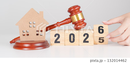 2025 end year to Happy New Year 2026 with small toy house model with gavel justice hammer on desk in courthouse. Real Estate Law, Home Insurance, property Tax, Auction and Bidding concepts 2025 end year to Happy New Year 2026 with small toy house model with gavel justice hammer on desk in courthouse. Real Estate Law, Home Insurance, property Tax, Auction and Bidding concepts 132014462