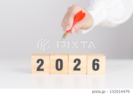 red dart with  chess people and 2026 year blocks.. Goal, plan, action, target, strategy, leadership, New Year and marketing concept 132014470