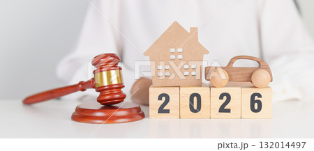 Happy New Year 2026 with house and Car model and gavel justice hammer on desk in courthouse. Real Estate and Car Law, Home Insurance, property Tax, Auction and Bidding concepts 132014497