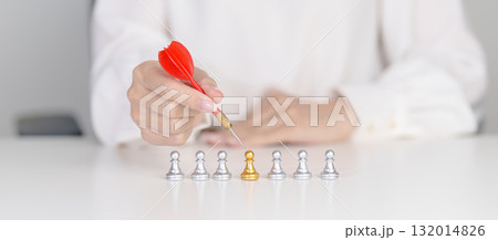 Hand point dart to golden chess pawn pieces or leader businessman stand out of crowd people of silver men. leadership, business, team, teamwork, unique and Human resource management concept Hand point dart to golden chess pawn pieces or leader businessman stand out of crowd people of silver men. leadership, business, team, teamwork, unique and Human resource management concept 132014826