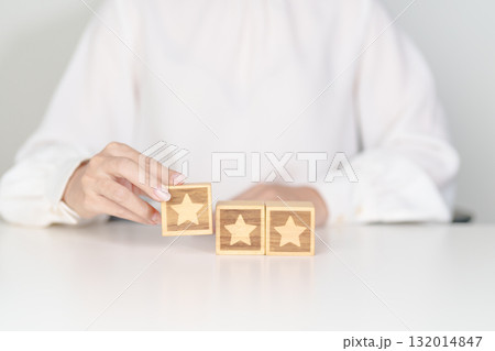 hand show Star block. Customer choose rating for user reviews. Service rating, ranking, customer review, satisfaction, evaluation and feedback concept hand show Star block. Customer choose rating for user reviews. Service rating, ranking, customer review, satisfaction, evaluation and feedback concept 132014847