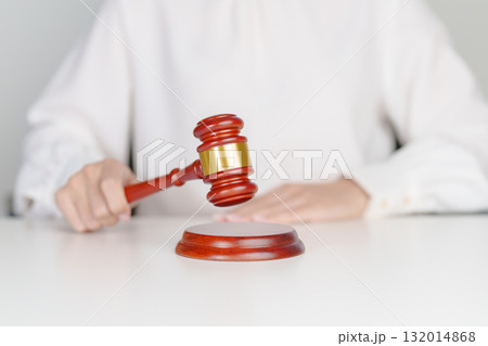 Woman Hand hold judge gavel. Law, lawyer, judgment, justice auction and bidding concept Woman Hand hold judge gavel. Law, lawyer, judgment, justice auction and bidding concept 132014868