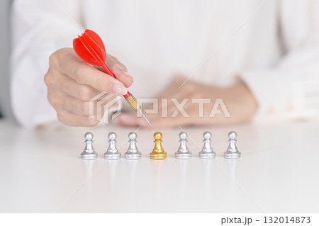 Hand point dart to golden chess pawn pieces or leader businessman stand out of crowd people of silver men. leadership, business, team, teamwork, unique and Human resource management concept Hand point dart to golden chess pawn pieces or leader businessman stand out of crowd people of silver men. leadership, business, team, teamwork, unique and Human resource management concept 132014873