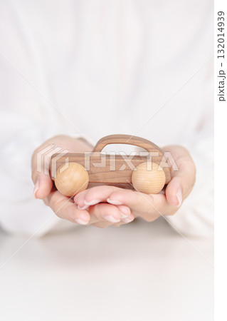 Woman hand holding wood car toy. Car insurance, warranty, rental, Financial, new and repair concept Woman hand holding wood car toy. Car insurance, warranty, rental, Financial, new and repair concept 132014939
