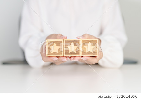 hand show Star block. Customer choose rating for user reviews. Service rating, ranking, customer review, satisfaction, evaluation and feedback concept hand show Star block. Customer choose rating for user reviews. Service rating, ranking, customer review, satisfaction, evaluation and feedback concept 132014956