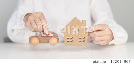 house and Car model on table. real estate, Home mortgage and car loan, tax, investment, financial, savings, interest rate, economic recession 132014967