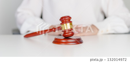 Woman Hand hold judge gavel. Law, lawyer, judgment, justice auction and bidding concept Woman Hand hold judge gavel. Law, lawyer, judgment, justice auction and bidding concept 132014972