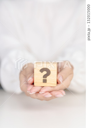 Wood block of Questions Mark sign. FAQ, frequency asked questions, Answer, Q and A, Information, Communication, problem and interrogation Concepts 132015000