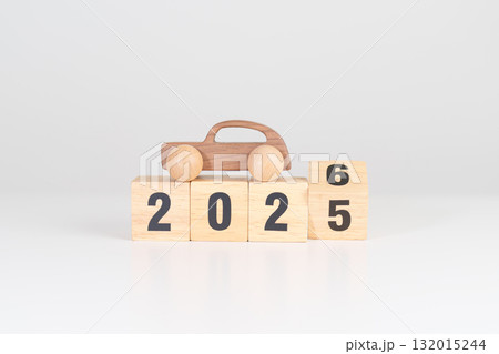 2025 end year to Happy New Year 2026 with Car model on table. Automobile Tax, Car Insurance, Financial, vehicle Repair and Maintenance and New Year concept 132015244