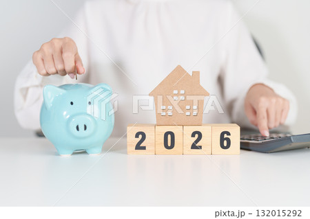 Happy New Year 2026 with house model and Coins stack. real estate, Home loan, tax, investment, mortgage, financial, savings and New Year Resolution concepts Happy New Year 2026 with house model and Coins stack. real estate, Home loan, tax, investment, mortgage, financial, savings and New Year Resolution concepts 132015292