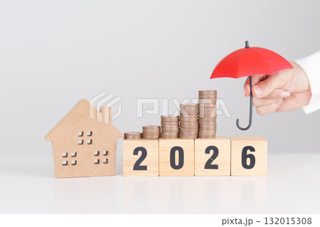 Happy New Year 2026 with red umbrella over money stack. Insurance, real estate, Home loan, tax, investment, mortgage, financial, savings, protection and safety Happy New Year 2026 with red umbrella over money stack. Insurance, real estate, Home loan, tax, investment, mortgage, financial, savings, protection and safety 132015308