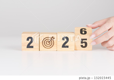 2025 year change to 2026 year block with dartboard icon. Goal, Target, Resolution, strategy, plan, Action, mission, motivation, and New Year start concepts 132015445