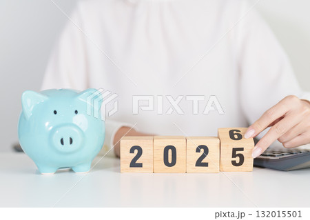 2025 end year to Happy New Year 2026 with piggy bank. Resolution, Goals, Plan, Action, Money Saving, Retirement fund, Pension, Investment and Financial concepts 132015501