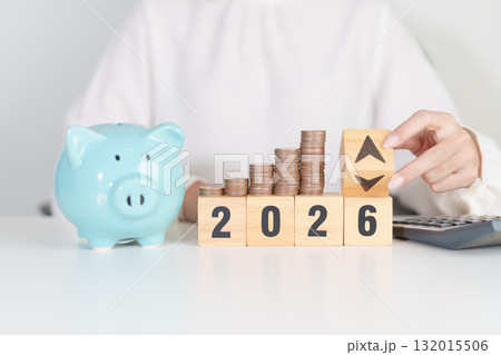2026 New year with change to UP and Down arrow with coin stack. Interest rate, GDP, stocks market, financial, deflation and Inflation, mortgage, debt, Loan and Economic Recession 132015506