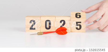 red dart with  chess people and 2026 year blocks.. Goal, plan, action, target, strategy, leadership, New Year and marketing concept 132015545