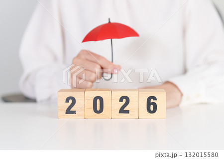 Happy New Year 2026 with hand holding red umbrella. Insurance, protection, safety and New year holiday Concepts 132015580