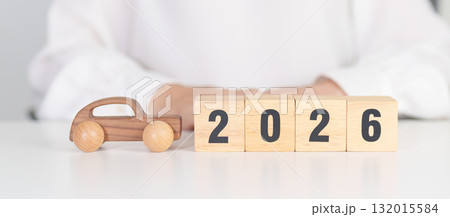 Happy New Year 2026 with Car model on table. Automobile Tax, Car Insurance, Financial, vehicle Repair and Maintenance and New Year concept 132015584