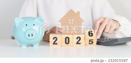 Happy New Year 2026 with house model and Coins stack. real estate, Home loan, tax, investment, mortgage, financial, savings and New Year Resolution concepts Happy New Year 2026 with house model and Coins stack. real estate, Home loan, tax, investment, mortgage, financial, savings and New Year Resolution concepts 132015597