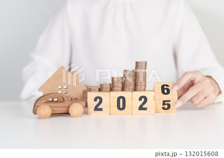 2025 end year to Happy New Year 2026 with car and Home model with coin stack. Car loan, Interest rate, real estate, house, Insurance, Financial, Repair, Tax, mortgage and Maintenance 132015608