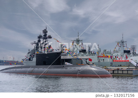 Submarine and naval ships in Vladivostok harbor during a sunny day Submarine and naval ships in Vladivostok harbor during a sunny day 132017156