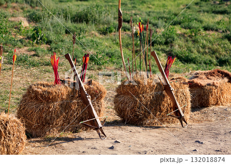 Crossbows, bow and arrows on the straw blocks 132018874