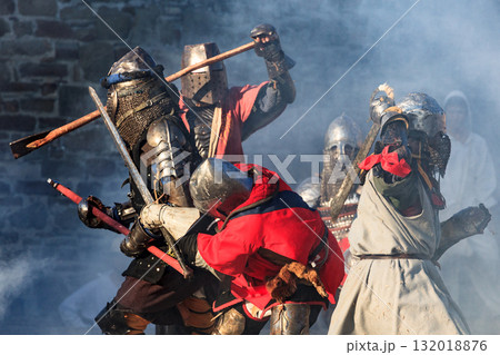 Medieval knights in severe battle action Medieval knights in severe battle action 132018876