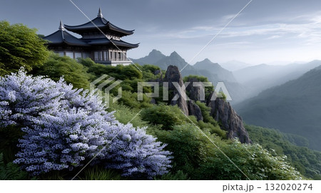 Traditional East Asian temple perched on a verdant mountainside, shrouded in mist with layered peaks, delicate blossoms in foreground and a calm, spiritual atmosphere 132020274