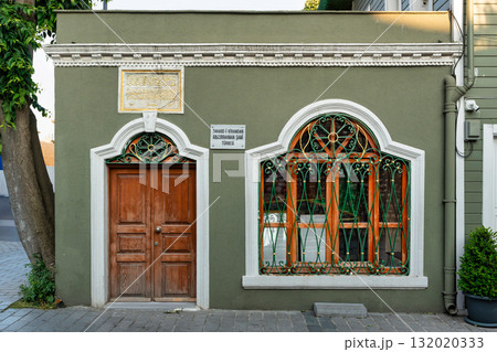 Abdurrahman Shami Tomb, Istanbul, Turkey. Green facade, ornate window grille, and traditional wooden door 132020333