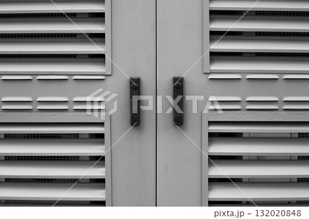 Industrial ventilation grilles with horizontal slats. Geometric design, in black and white tones, emphasizes texture and functionality, for architectural, industrial and design themes Industrial ventilation grilles with horizontal slats. Geometric design, in black and white tones, emphasizes texture and functionality, for architectural, industrial and design themes 132020848