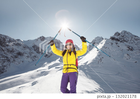 Woman Standing on Snow-Covered Slope Woman Standing on Snow-Covered Slope 132021178