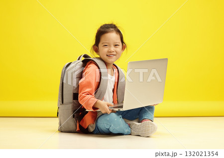 Smiling milling Asian Girl with Laptop Prepares for Primary School Smiling milling Asian Girl with Laptop Prepares for Primary School 132021354